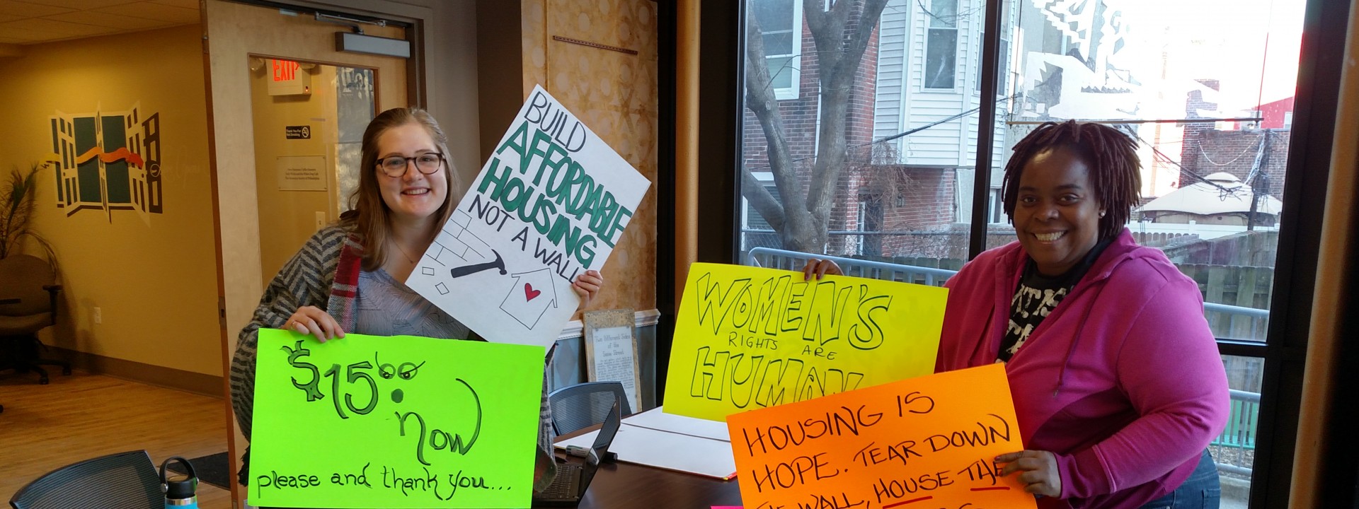 Project HOME advocates gathering signs for an action