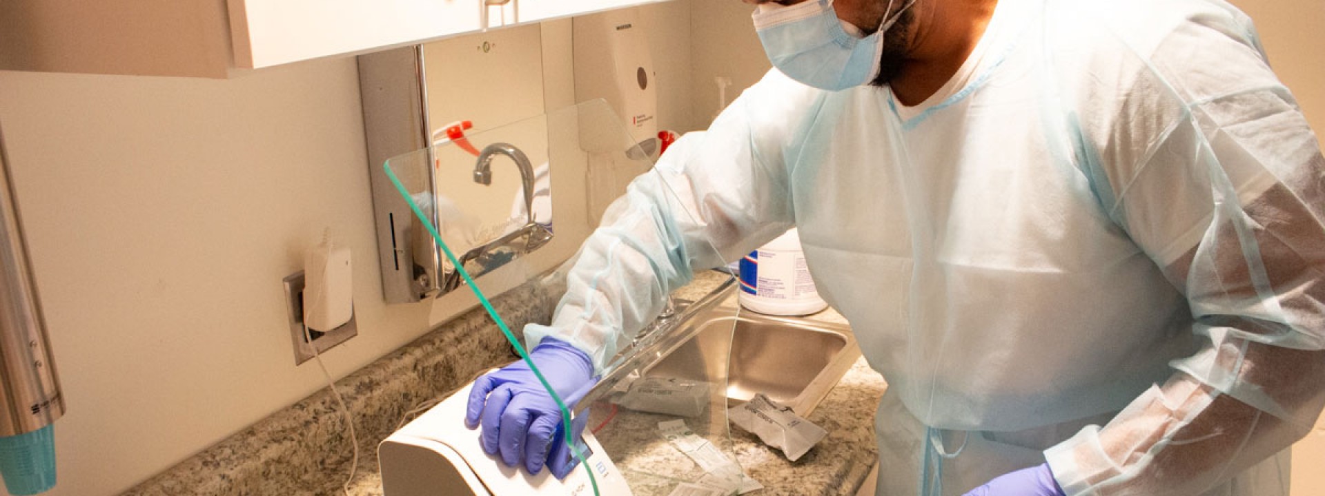A medical technician conducting rapid COVID-19 testing