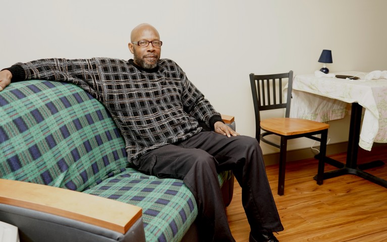 A man sitting on a sofa