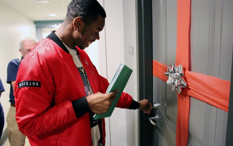 A Project HOME resident using his key for the first time