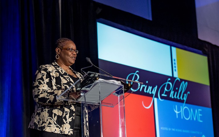 A presenter speaking at the Bring Philly HOME event