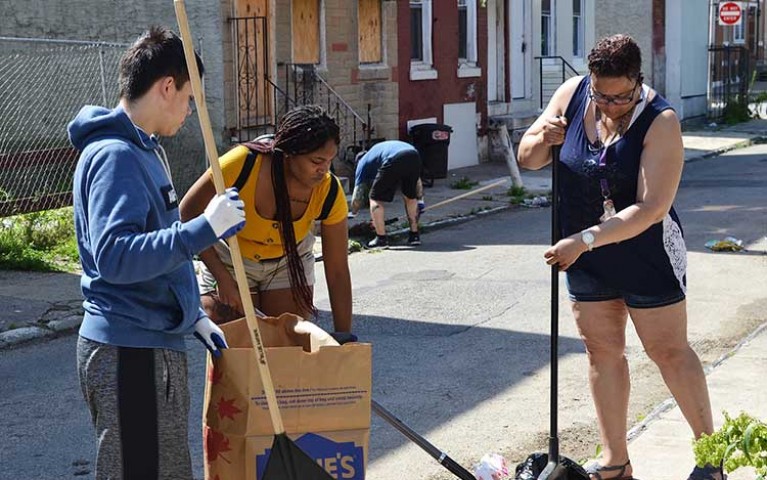 Project HOME volunteers cleaning up a Philadelphia neighborhood