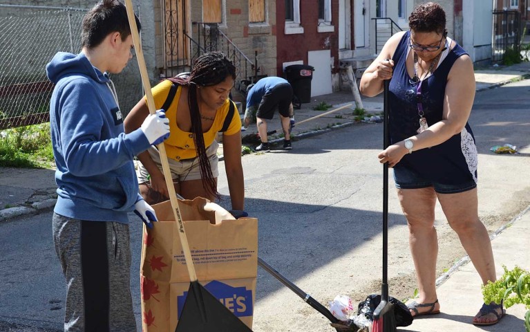 Project HOME volunteers working during a clean-up day