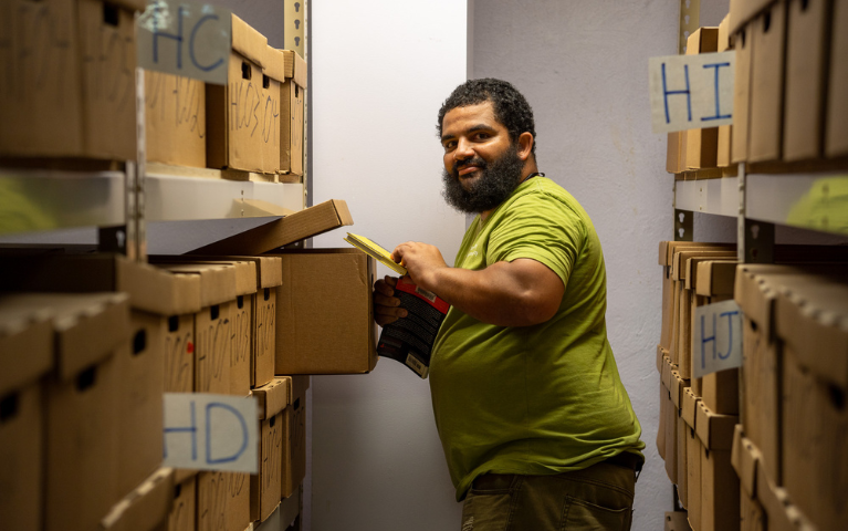 A man filing away books