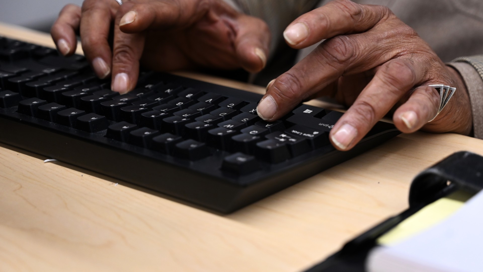 Adult Education participant hands typing