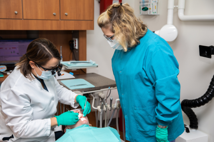 Dentists working on a patient