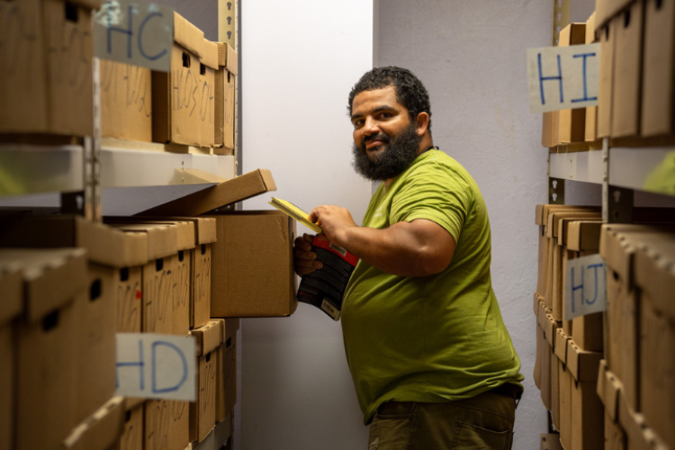 A man filing away books