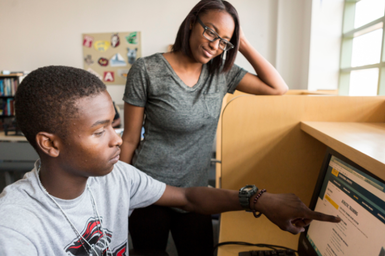 Two students researching something online.