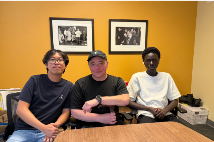 Andy (left), Richard (center) and Mouhamadou (right) strike a pose on their final day together.